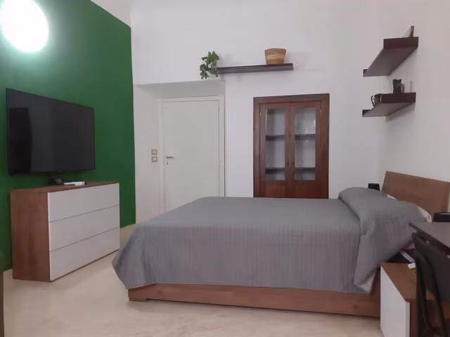 Camera con letto matrimoniale de Le Stanze del Corso